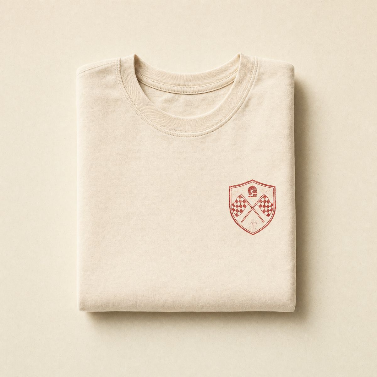 Rosso tee in washed cream cotton with small red graphic